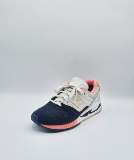 New Balance 530 Sneakers in a black, white, and coral Colorway